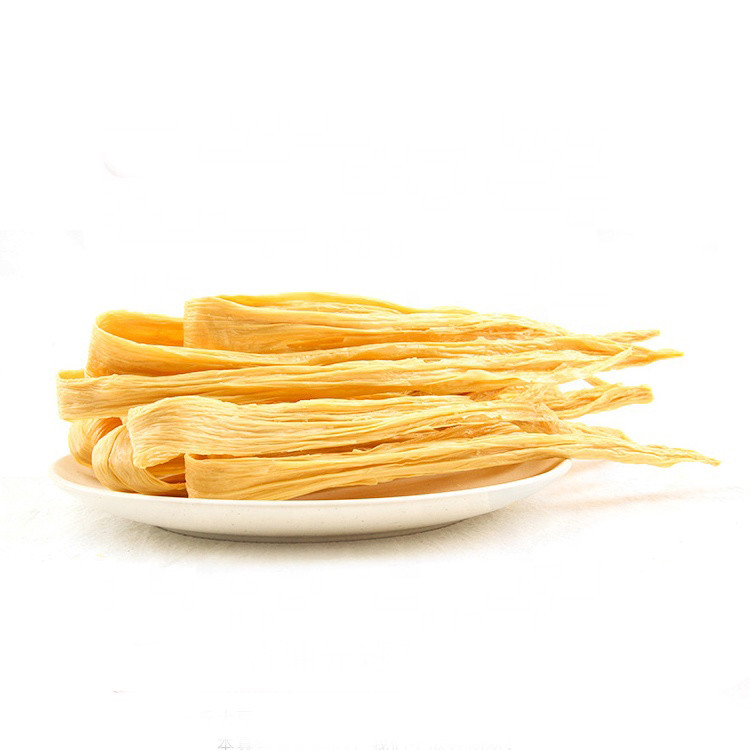 明るい黄色のユバ 乾燥した豆腐 皮膚タンパク質 繊維 菜食食品 水に浸す 30分前調理